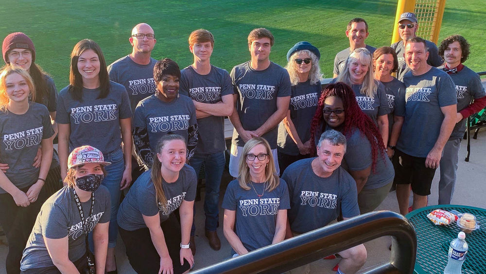 Group of people outside wearing Penn State York shirts