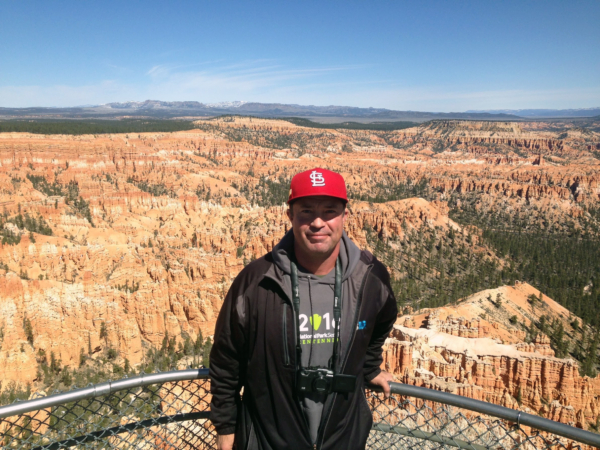 Man standing outside near a canyon