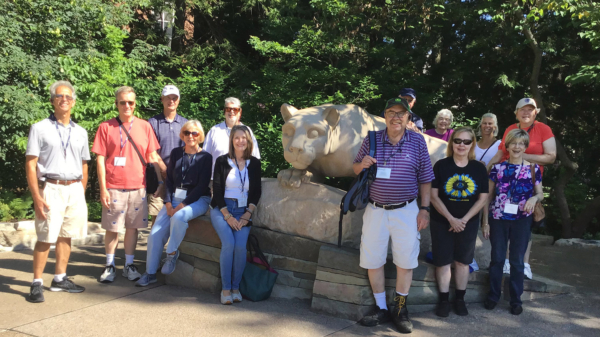 Group of OLLI members standing around the Penn State Nittany Lion statue