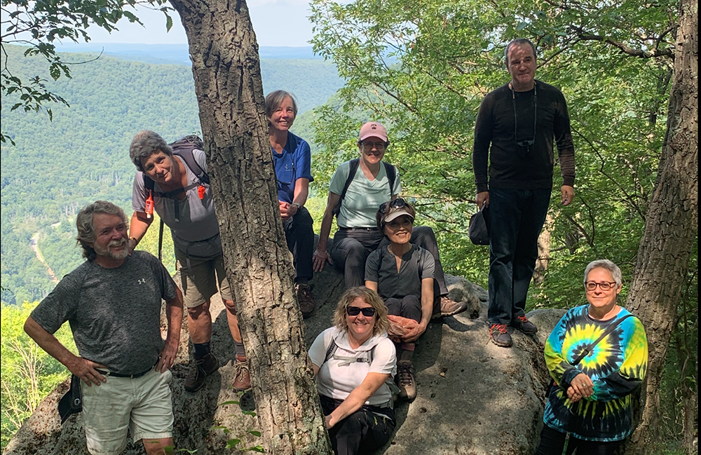 Group of adults outside on a hiking trail