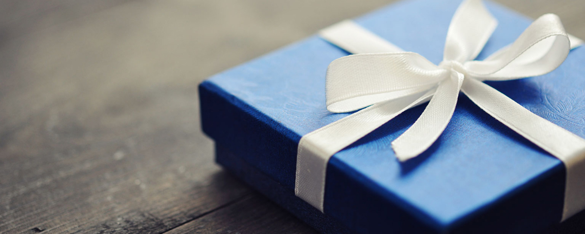 Blue gift box with a white ribbon