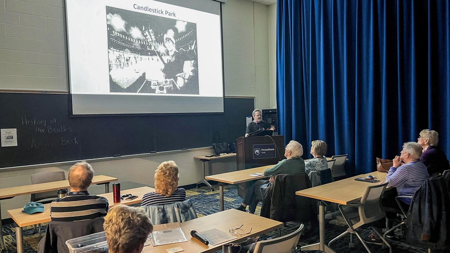 OLLI York members watch a presentation in a classroom