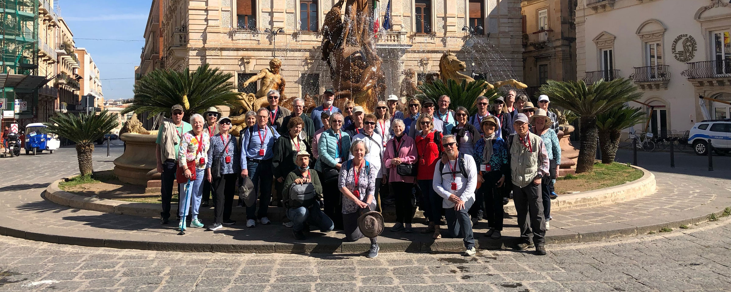 OLLI members in front of a fountain in Sicily