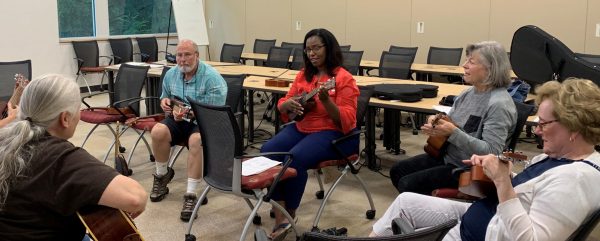 OLLI Members playing the ukulele